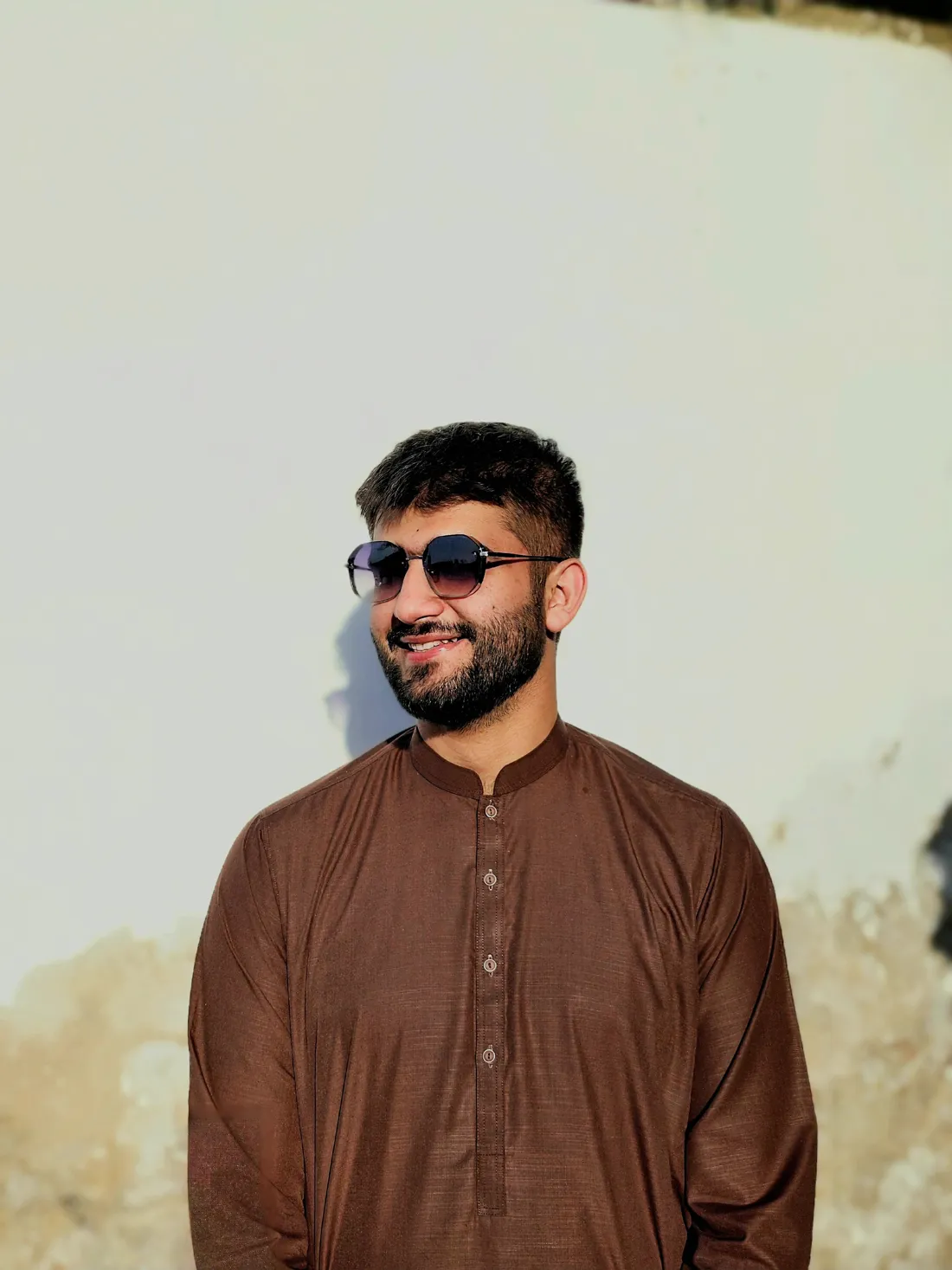Portrait of Muhammad Bazil smiling in sunglasses